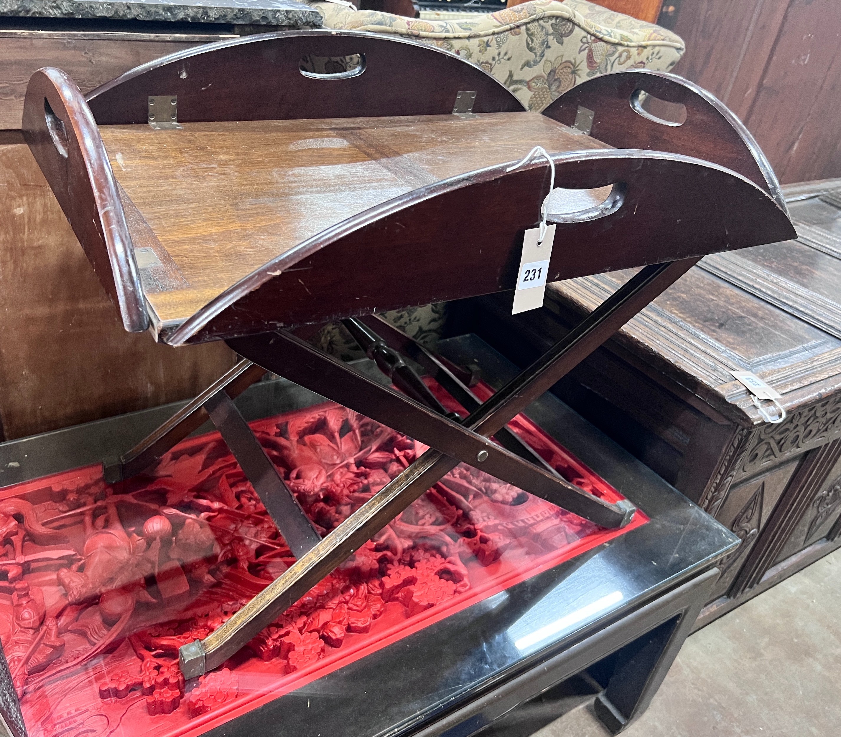 A mahogany butler's tray on folding stand, width 70cm *Please note the sale commences at 9am.